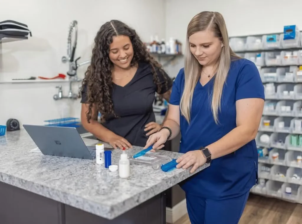 Paw Haven Animal Hospital staff preparing pet medication and supplies
